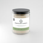 White Sage + Lavender 9 oz soy candle shown lit in a warm home setting - Noir Glow Candles